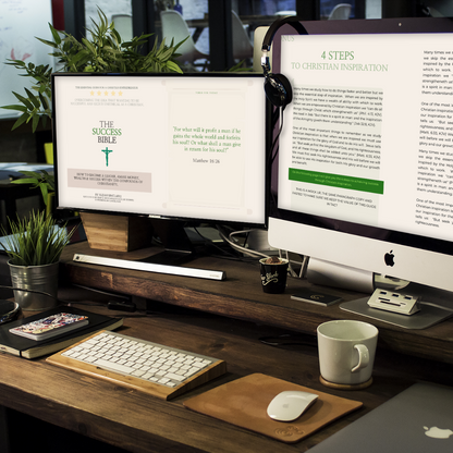 Real-life office setting featuring 'THE SUCCESS BIBLE - The Essential Guide For A Christian Entrepreneur': Guide displayed on multiple screens, showcasing front cover and pages from inside the book.